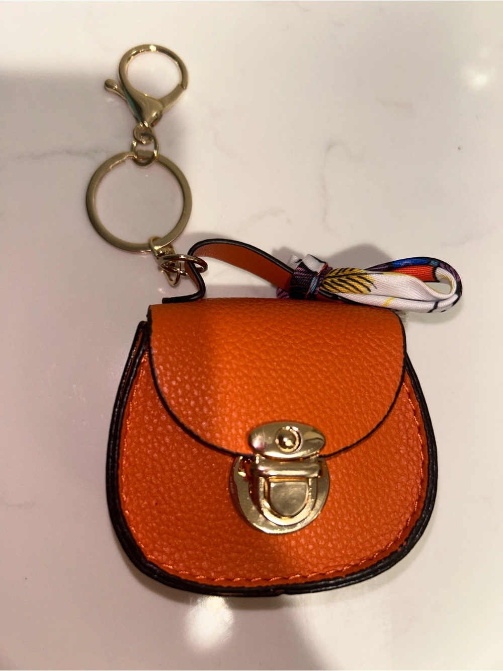 Mini bag  orange  functioning, holds AirPods, cash,etc bagcharm/keychain NWOT